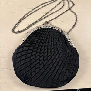 Black event purse with silver chain and detailing